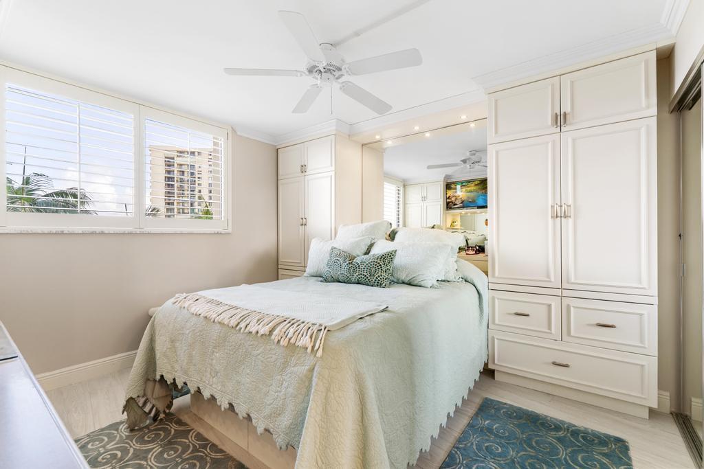 200 Ocean Trail Way, Unit T7 Jupiter, FL 33477 - Photo 26 of 46 a spacious bedroom with a bed and a window