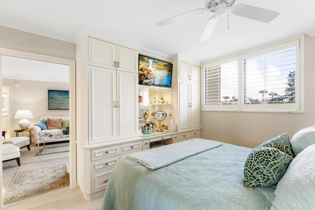 200 Ocean Trail Way, Unit T7 Jupiter, FL 33477 - Photo 27 of 46 a bedroom with a bed and a window