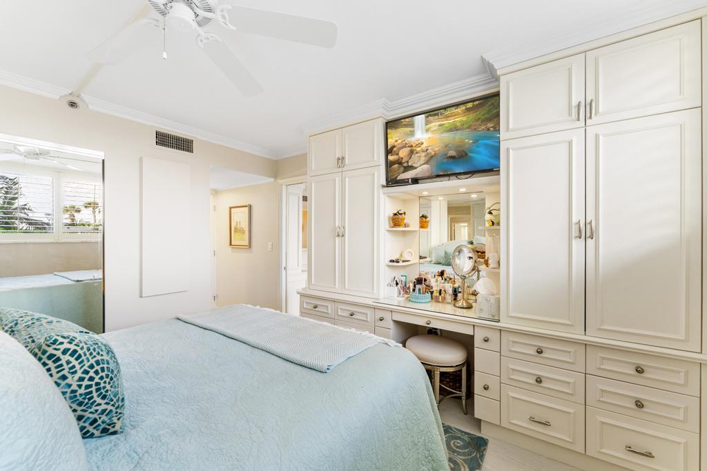 200 Ocean Trail Way, Unit T7 Jupiter, FL 33477 - Photo 28 of 46 a bedroom with a bed and a window