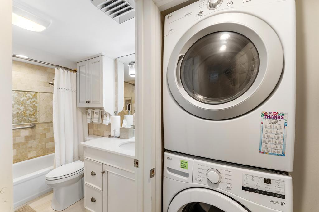 200 Ocean Trail Way, Unit T7 Jupiter, FL 33477 - Photo 30 of 46 a view of a bathroom with washing machine and sink