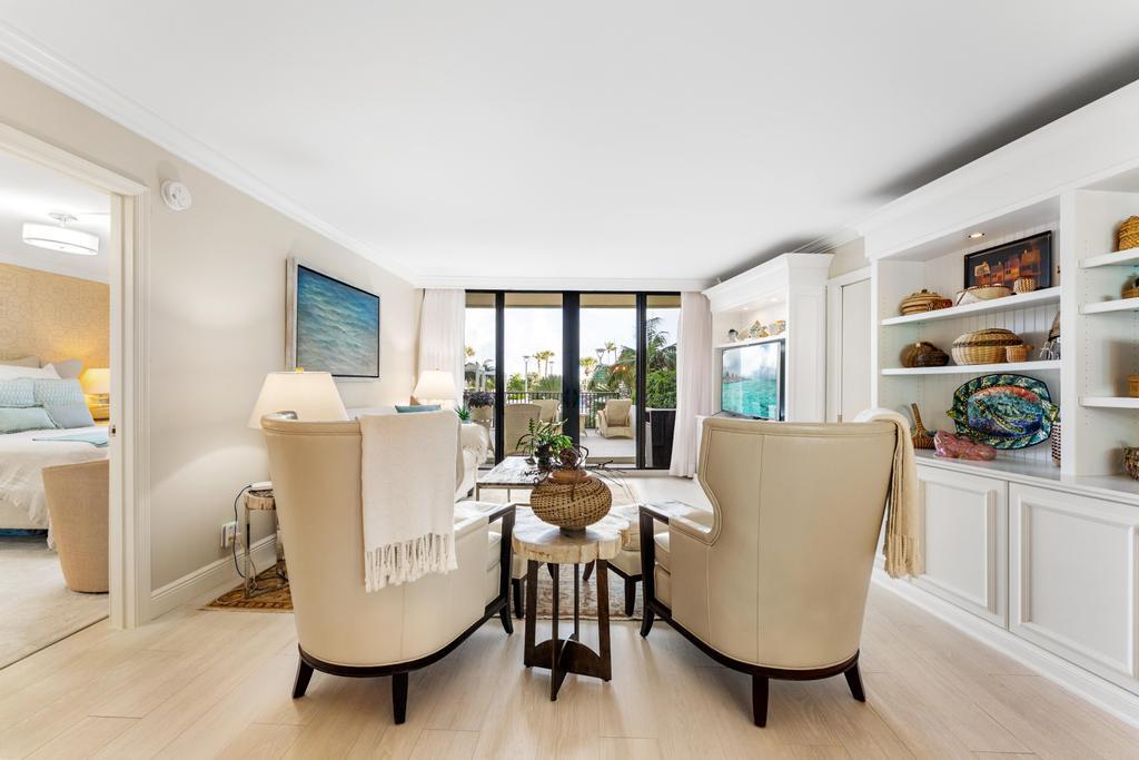 200 Ocean Trail Way, Unit T7 Jupiter, FL 33477 - Photo 3 of 46 a living room with furniture a large window and dining table