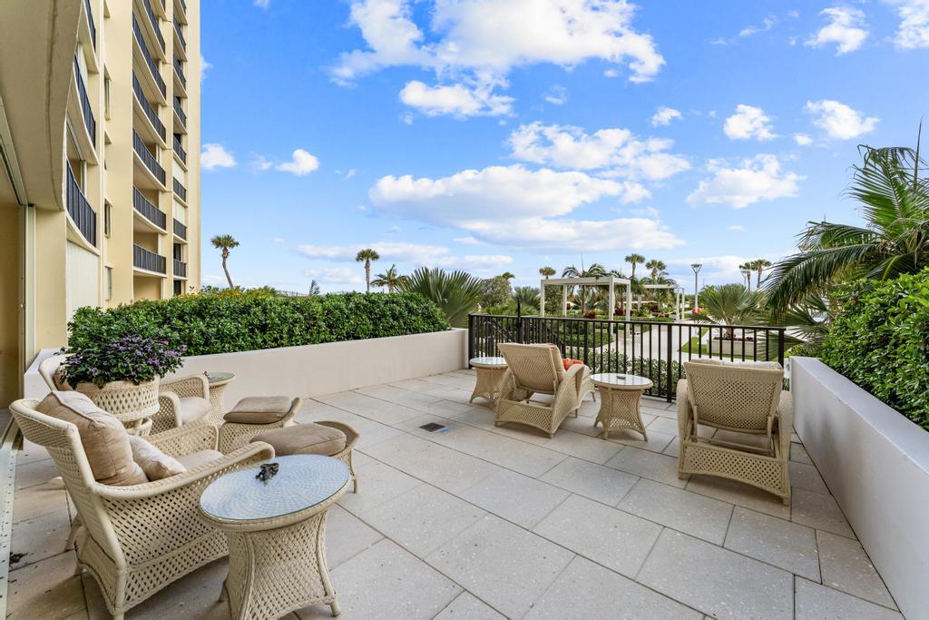 200 Ocean Trail Way, Unit T7 Jupiter, FL 33477 - Photo 34 of 46 a roof deck with couches and potted plants