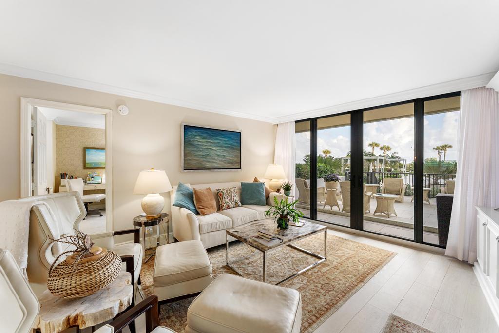 200 Ocean Trail Way, Unit T7 Jupiter, FL 33477 - Photo 6 of 46 a living room with furniture and a large window