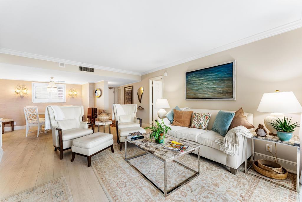 200 Ocean Trail Way, Unit T7 Jupiter, FL 33477 - Photo 9 of 46 a living room with furniture and a lamp