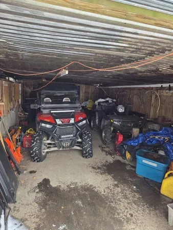 a view of a garage with parked cars