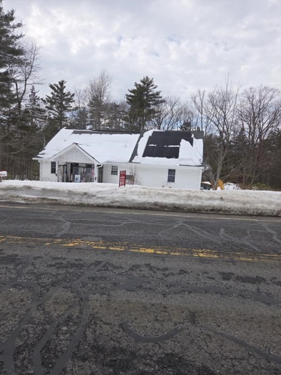 1578 Greenville Road Ashby, MA 01431 - Photo 2 of 17 a front view of a house with a yard