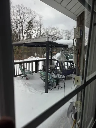 a view of a balcony with furniture