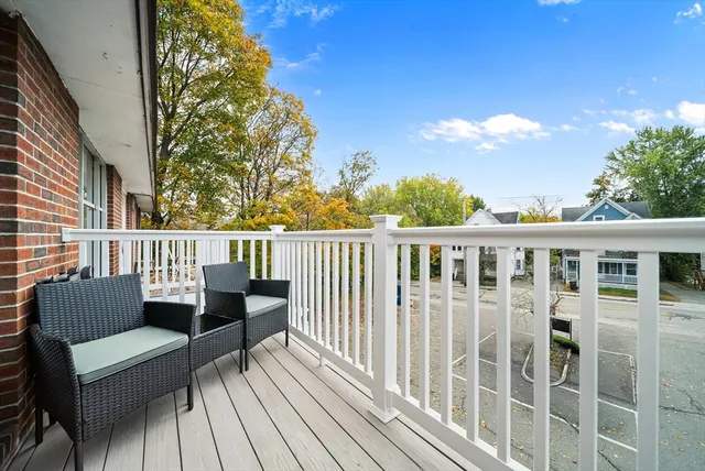a view of a deck with couches and wooden floor