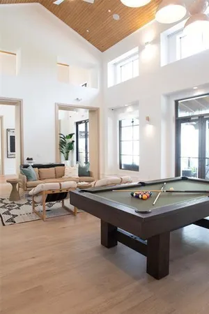 a living room with granite countertop furniture and floor to ceiling window