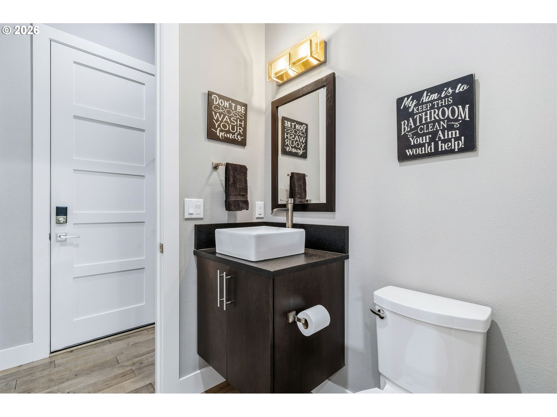 1203 South Great Blue Road Ridgefield, WA 98642 - Photo 22 of 48 a bathroom with a sink a toilet and mirror