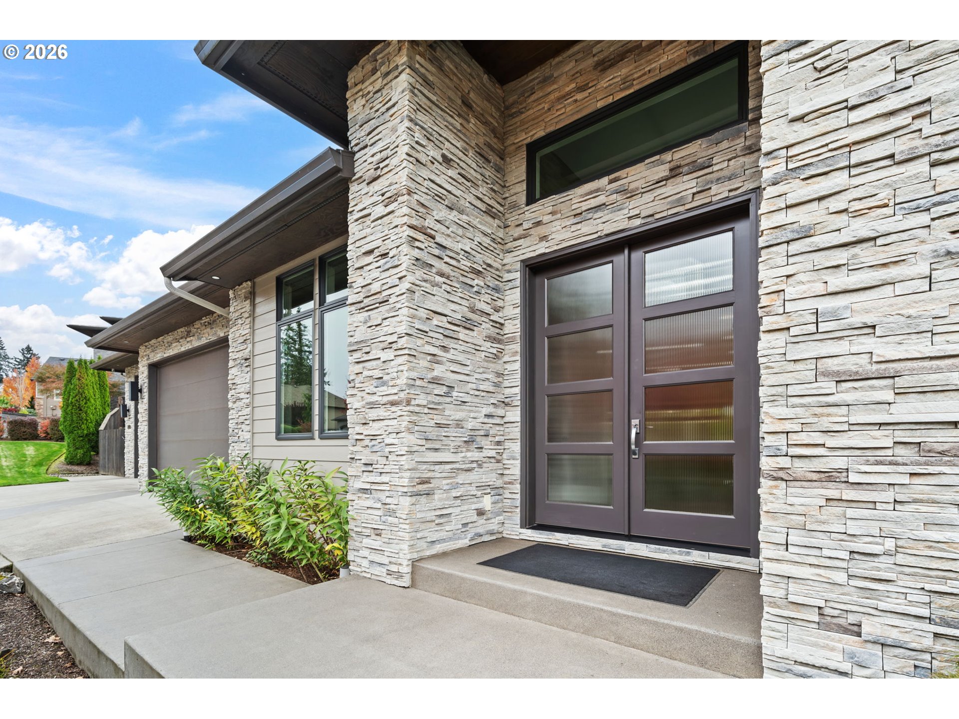 1203 South Great Blue Road Ridgefield, WA 98642 - Photo 3 of 48 a front view of a house with a yard
