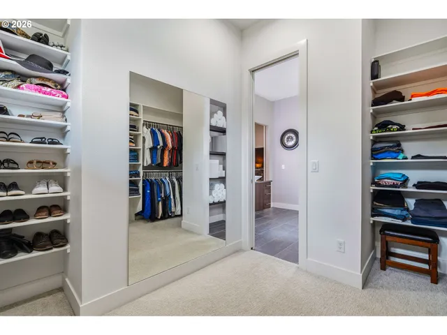 a living room with furniture and a book shelf