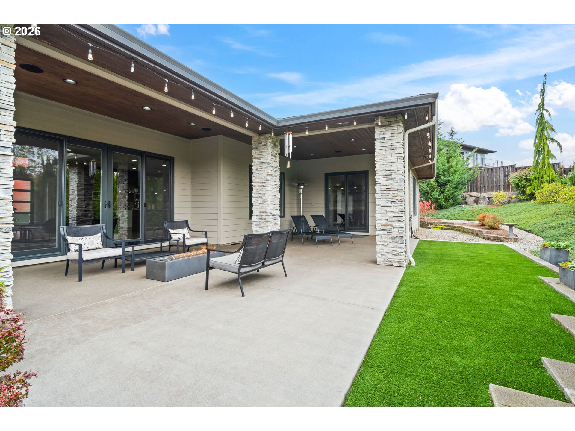 1203 South Great Blue Road Ridgefield, WA 98642 - Photo 38 of 48 a view of a house with patio and a yard