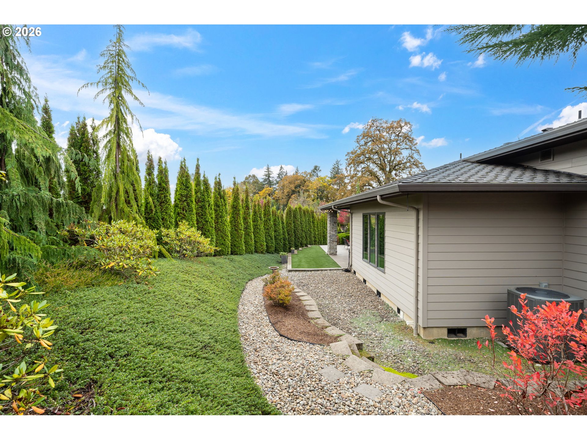 1203 South Great Blue Road Ridgefield, WA 98642 - Photo 41 of 48 a view of a wooden house with a yard