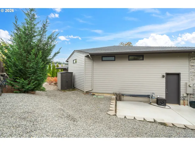 a view of a backyard of a house