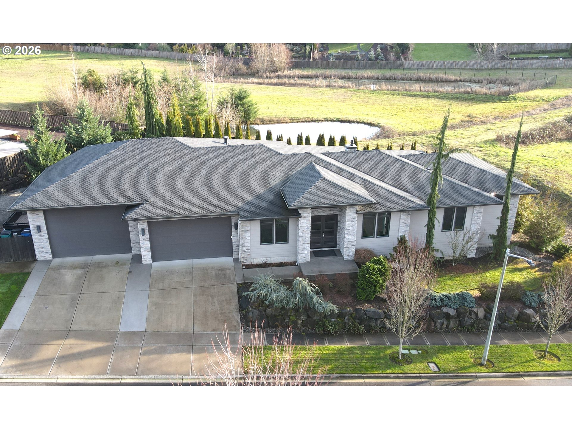 1203 South Great Blue Road Ridgefield, WA 98642 - Photo 46 of 48 a house view with a garden and pool