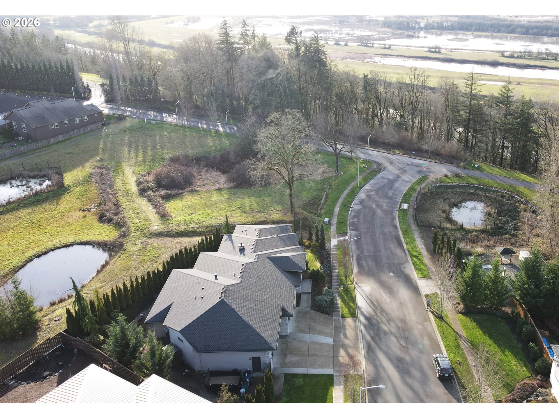 1203 South Great Blue Road Ridgefield, WA 98642 - Photo 48 of 48 an aerial view of a house with garden space and lake view