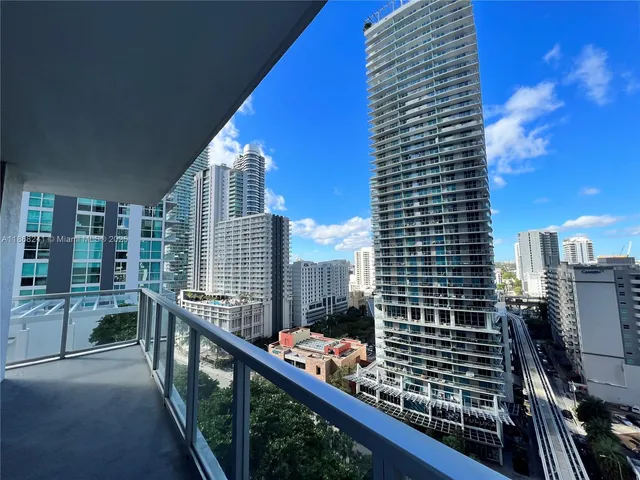 a view of a patio with plants and chairs