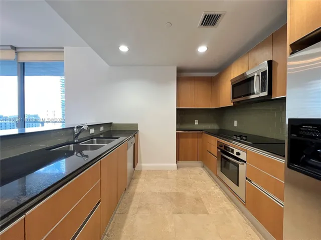 a kitchen with a stove and a microwave