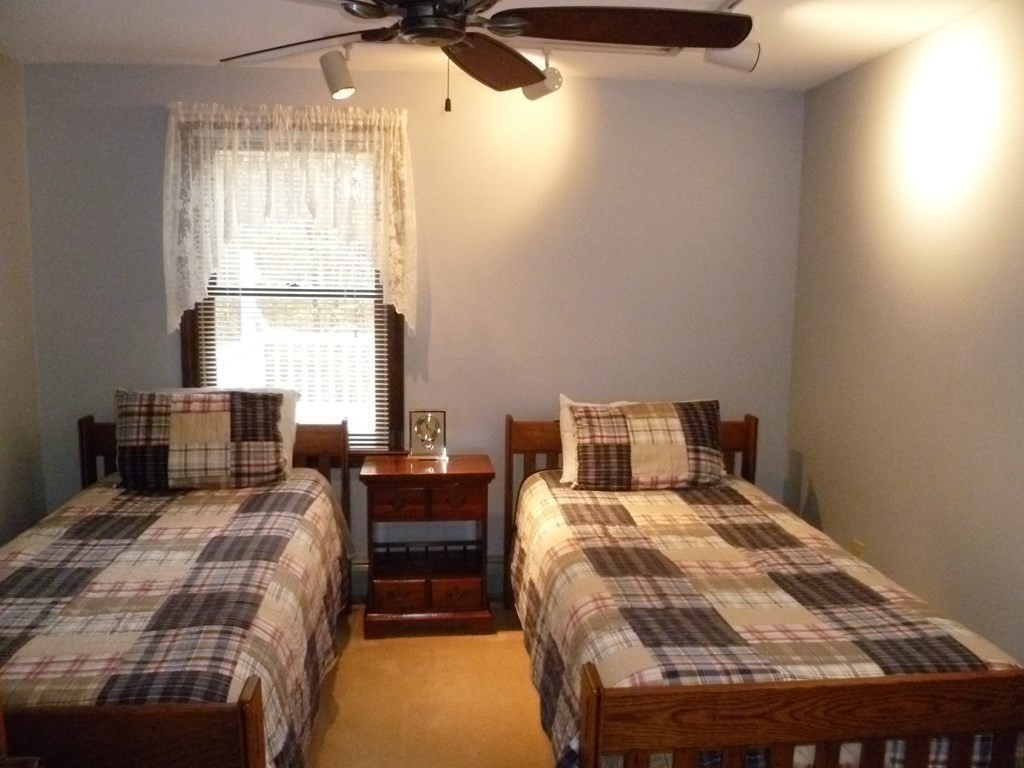 1209 Amostown Road West Springfield, MA 01089 - Photo 12 of 29 a bedroom with a bed and wooden floor