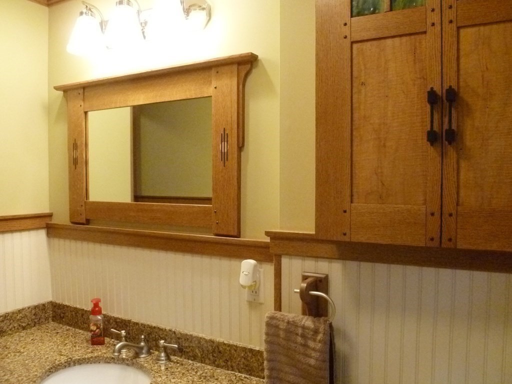 1209 Amostown Road West Springfield, MA 01089 - Photo 14 of 29 a bathroom with a granite countertop sink and a mirror