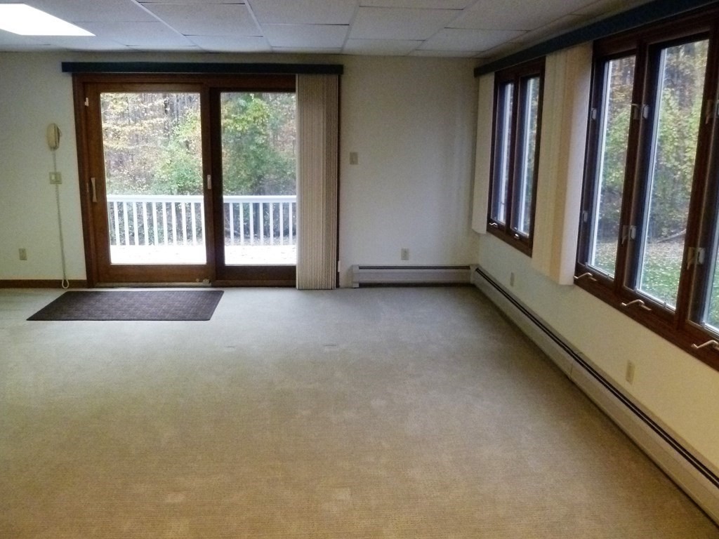 1209 Amostown Road West Springfield, MA 01089 - Photo 18 of 29 a view of an empty room with a window