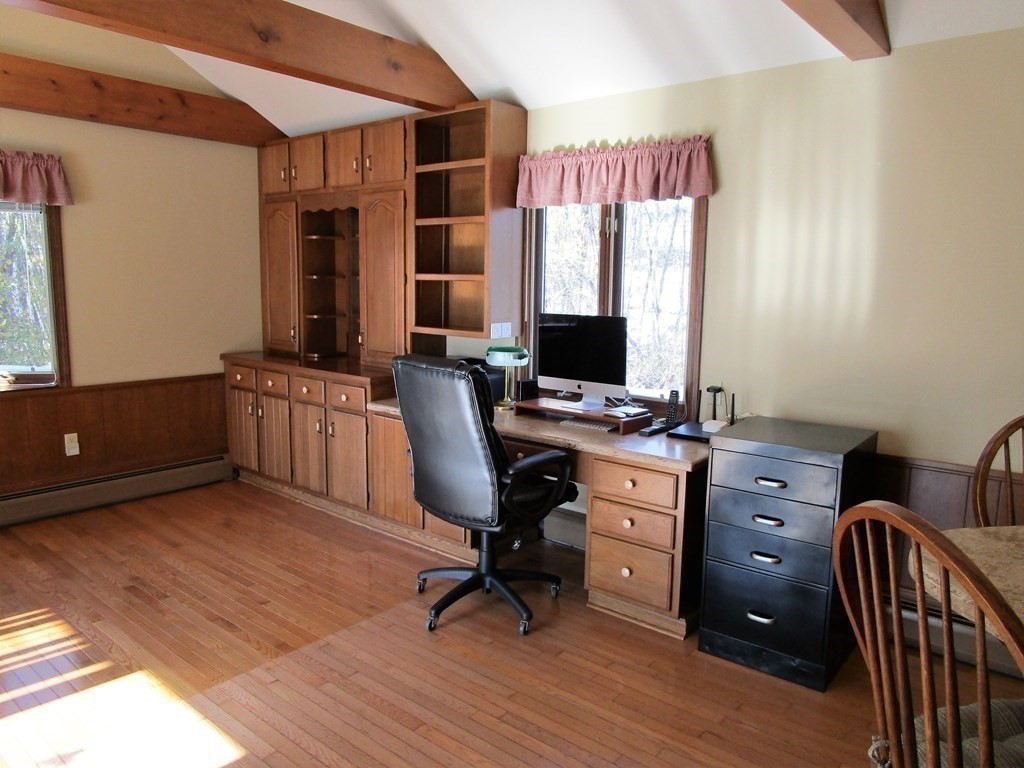 1209 Amostown Road West Springfield, MA 01089 - Photo 6 of 29 a view of a workspace with furniture and a window