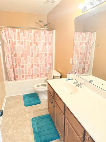 a bathroom with a sink a bathtub and a shower