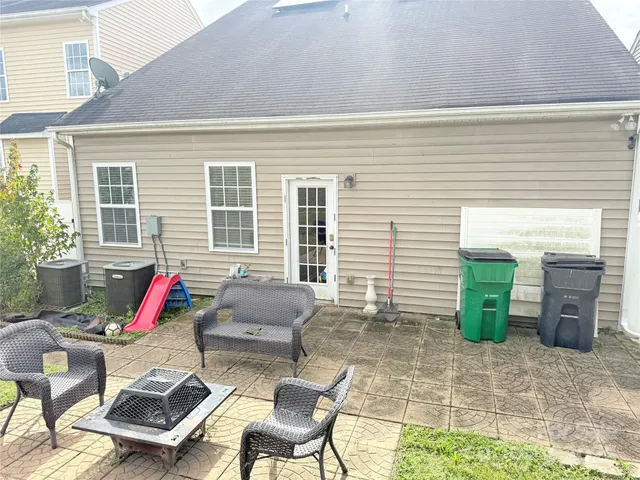 a view of backyard with outdoor seating