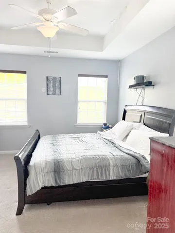 a bedroom with a bed and window