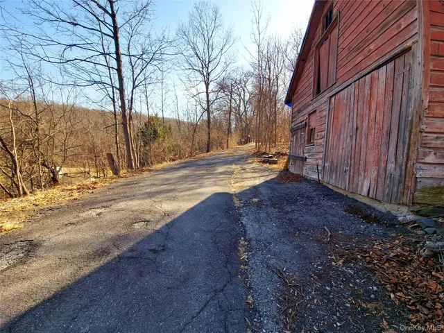 a view of empty space with wooden fence