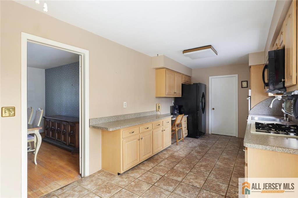 9 Woodruff Road Edison, NJ 08820 - Photo 13 of 39 a kitchen with granite countertop a refrigerator stove and sink