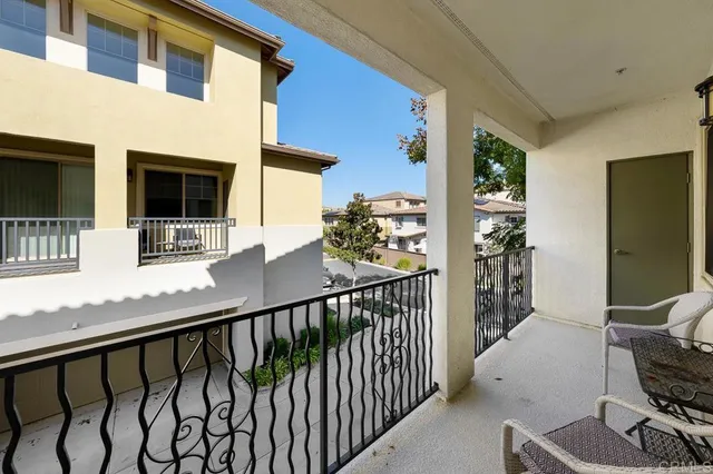a view of balcony with furniture