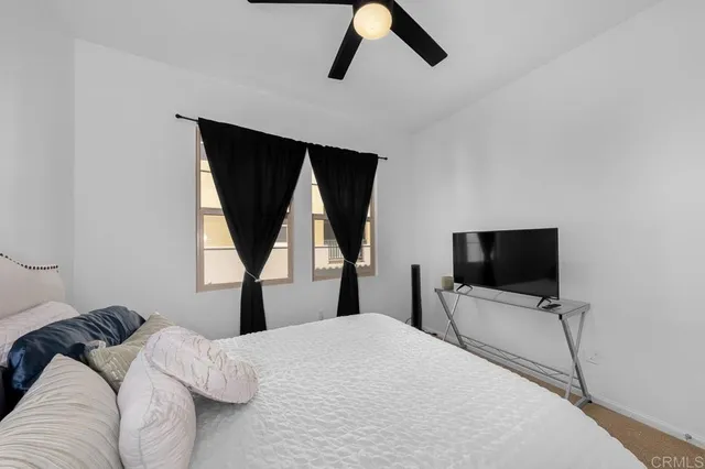 a bedroom with a bed and window