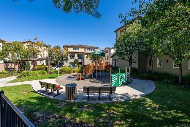 a view of a chairs and table in backyard of the house