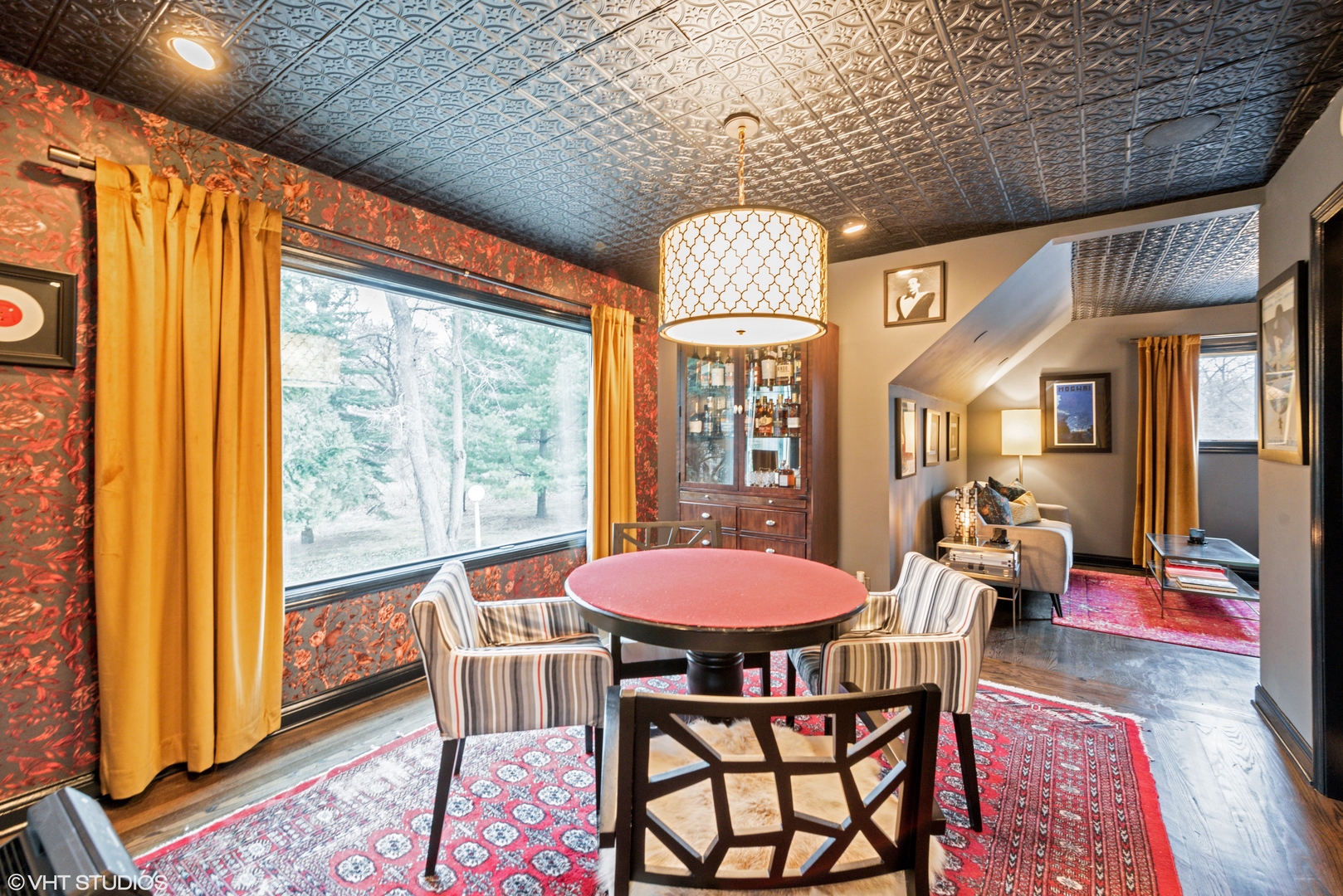 6208 Katmai Trail McHenry, IL 60050 - Photo 18 of 24 a dining room with furniture a chandelier and wooden floor