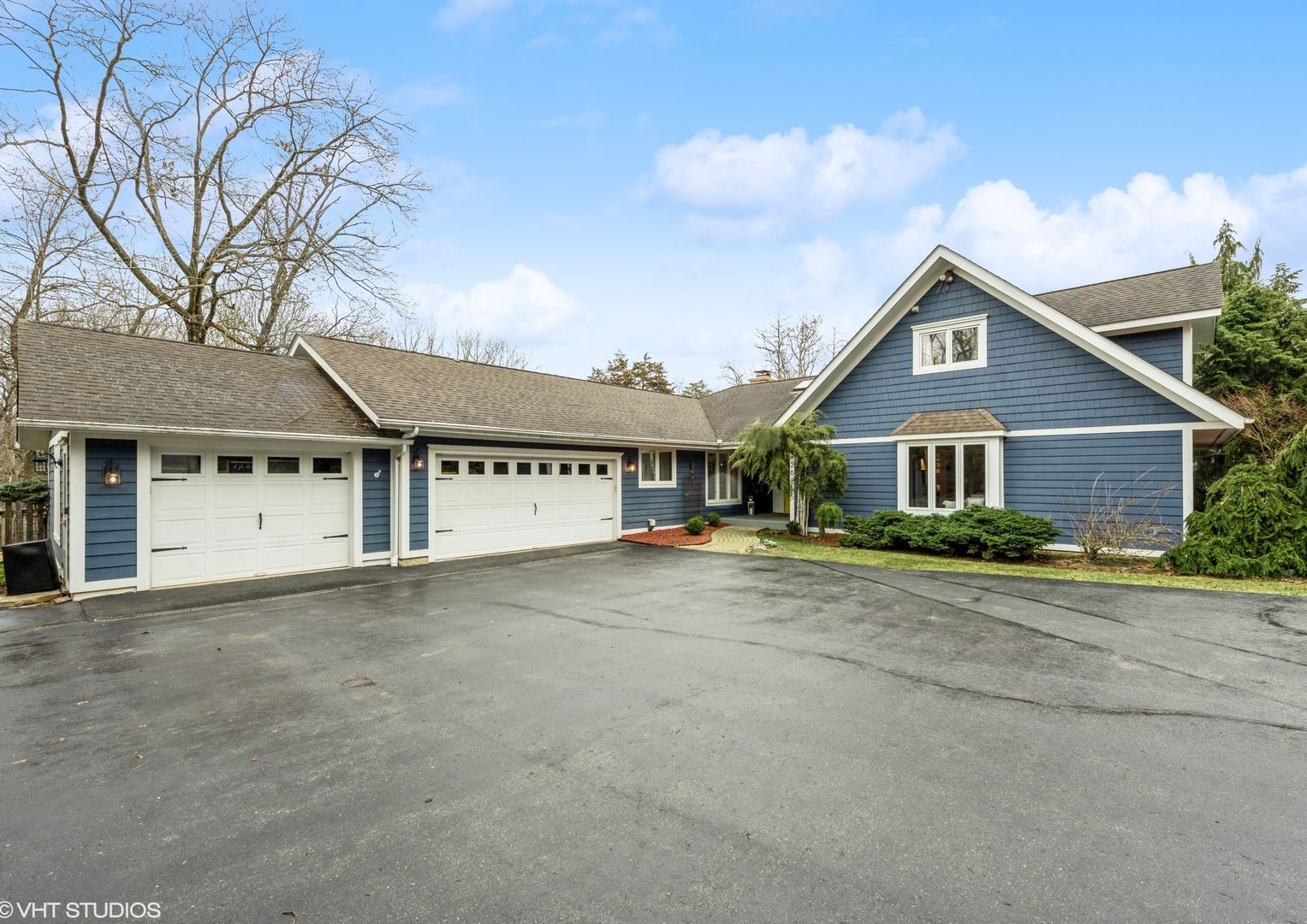6208 Katmai Trail McHenry, IL 60050 - Photo 2 of 24 a front view of a house with a yard and garage