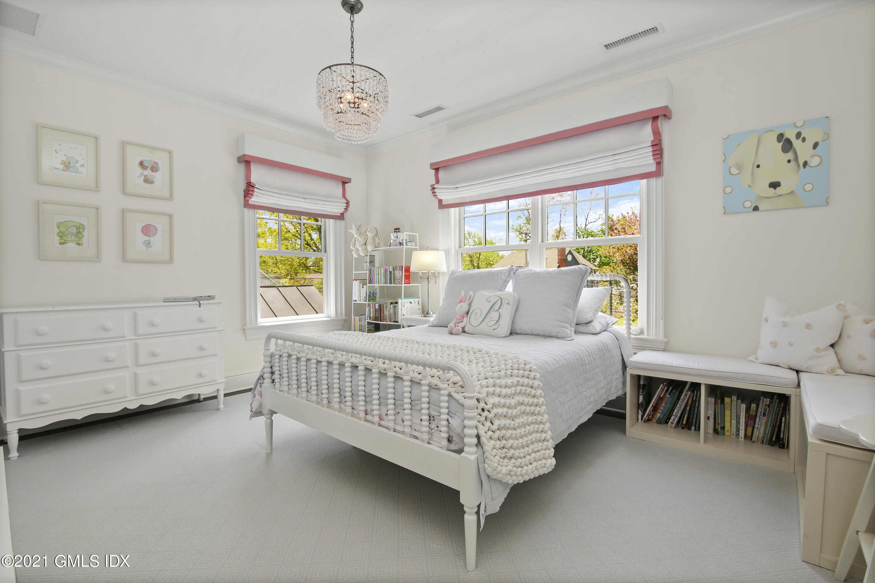 16 Benjamin Street Old Greenwich, CT 06870 - Photo 19 of 32 a bedroom with a bed chandelier and a window