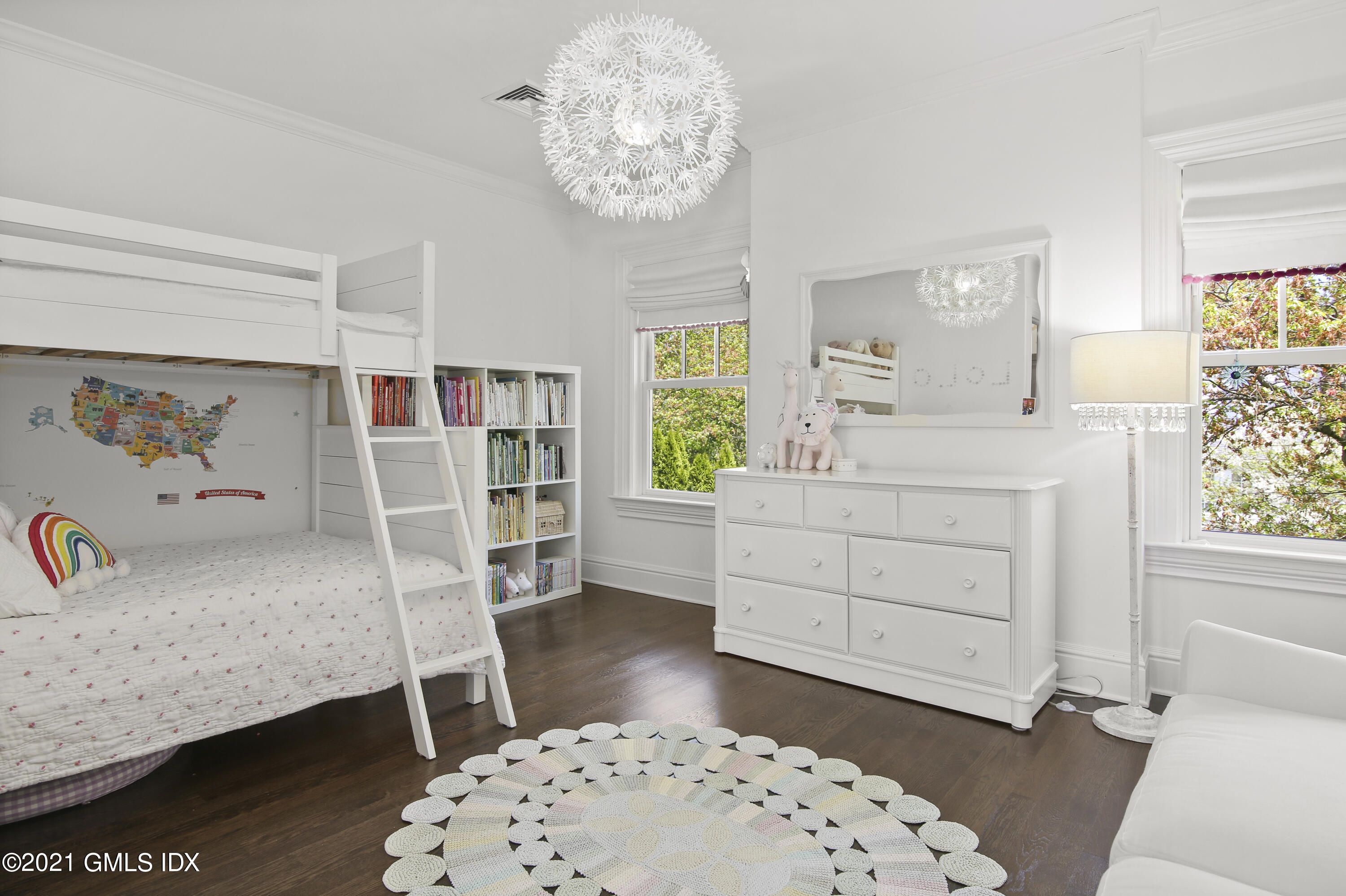 16 Benjamin Street Old Greenwich, CT 06870 - Photo 21 of 32 a bedroom with a bed and a dresser in it