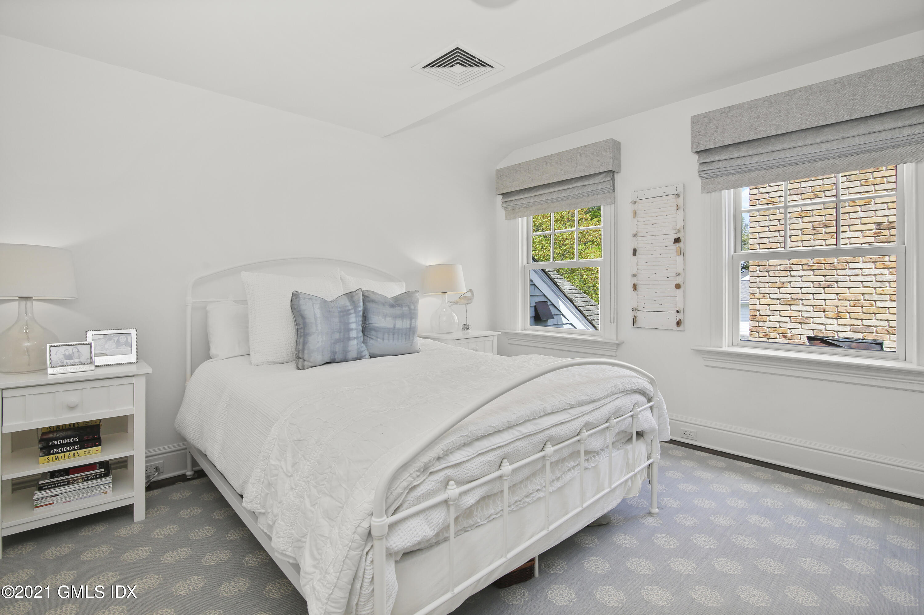 16 Benjamin Street Old Greenwich, CT 06870 - Photo 22 of 32 a bedroom with a bed and a window