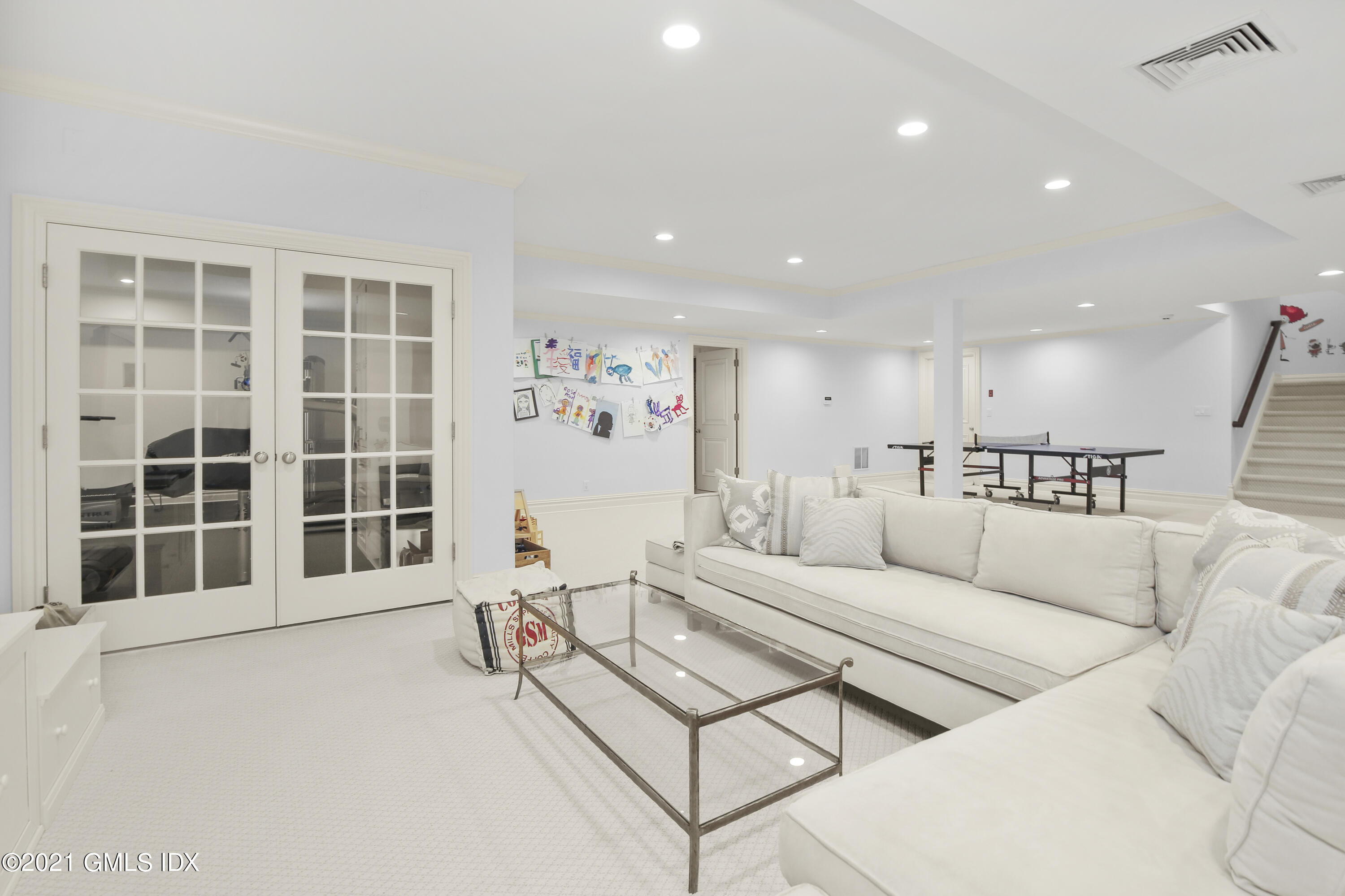 16 Benjamin Street Old Greenwich, CT 06870 - Photo 25 of 32 a living room with furniture and a large window