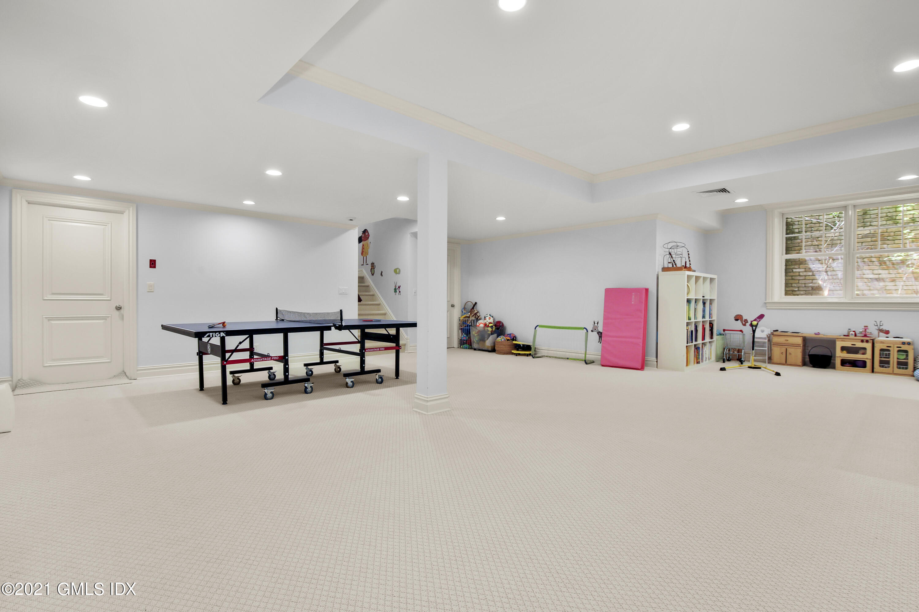 16 Benjamin Street Old Greenwich, CT 06870 - Photo 28 of 32 a large room with furniture and a table