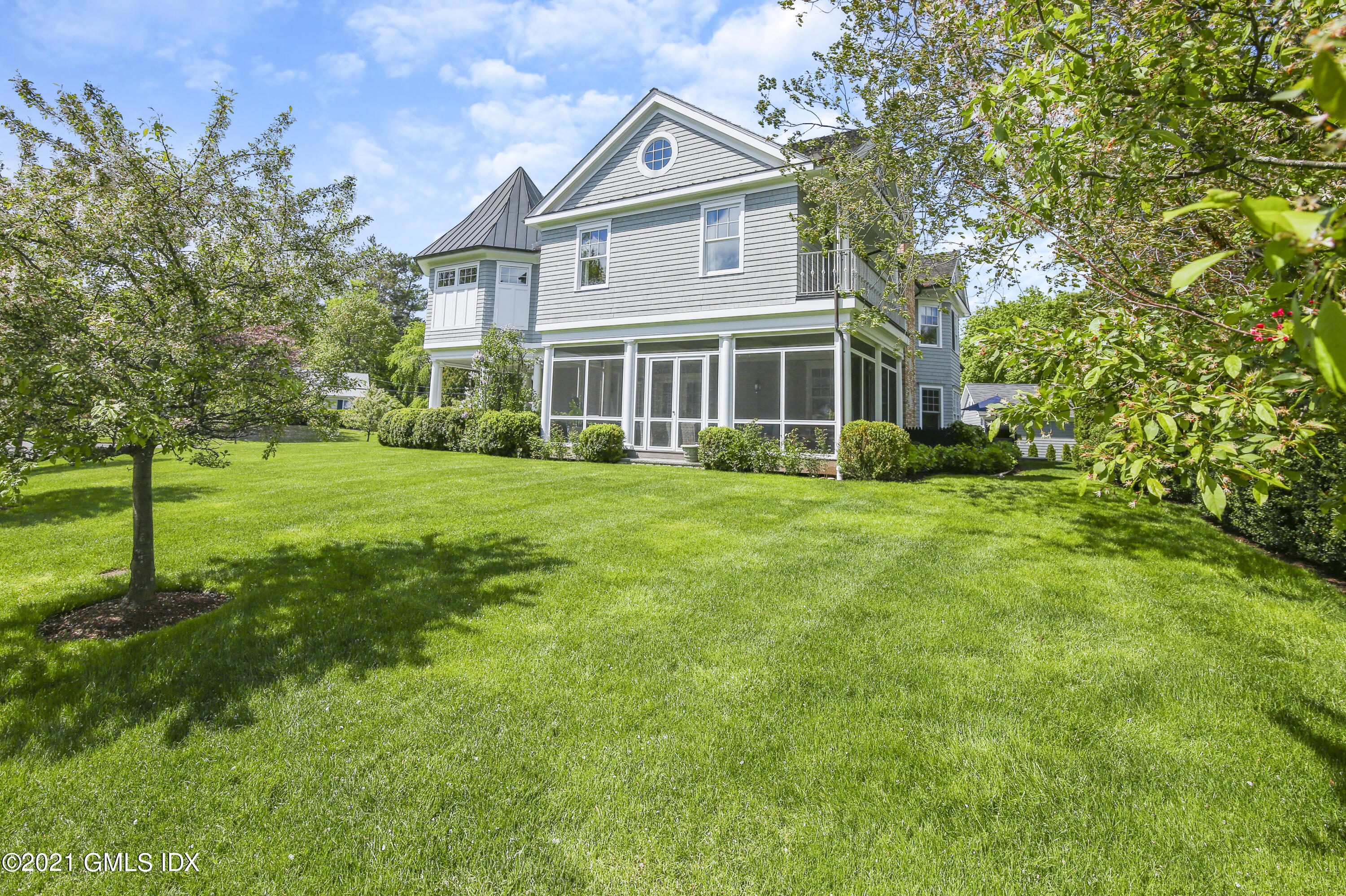 16 Benjamin Street Old Greenwich, CT 06870 - Photo 30 of 32 a view of a house with a big yard and large trees