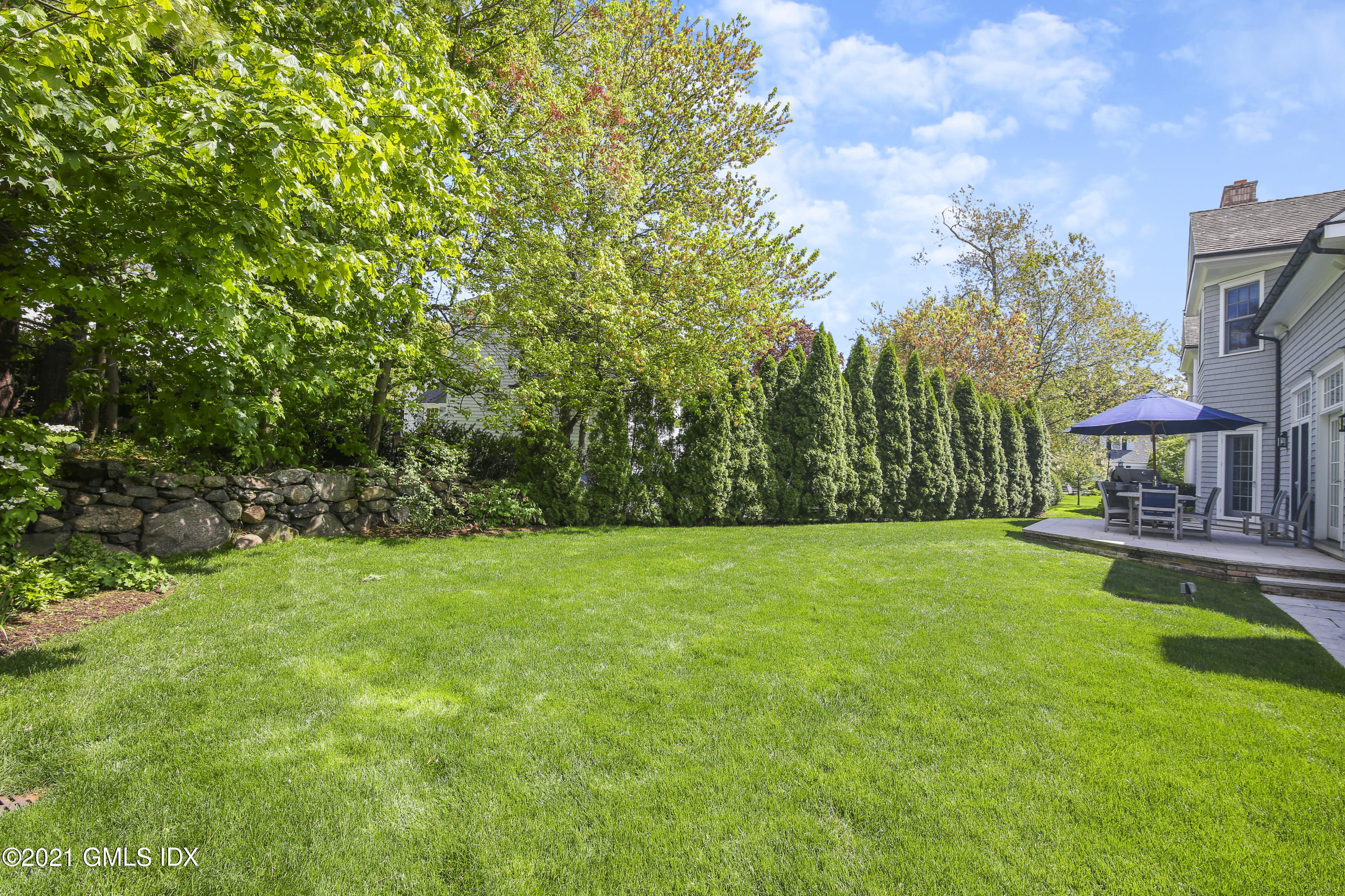16 Benjamin Street Old Greenwich, CT 06870 - Photo 31 of 32 a view of a backyard with sitting area