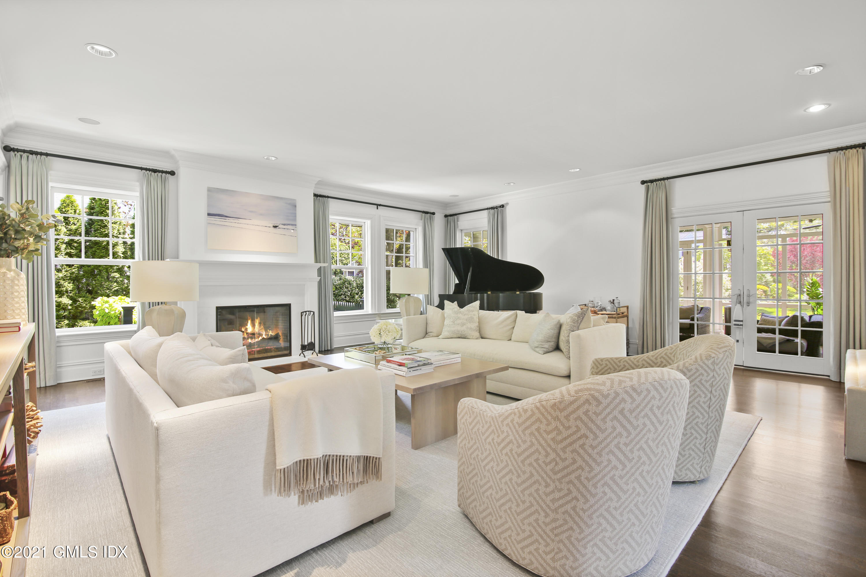 16 Benjamin Street Old Greenwich, CT 06870 - Photo 4 of 32 a living room with furniture fireplace and a large window