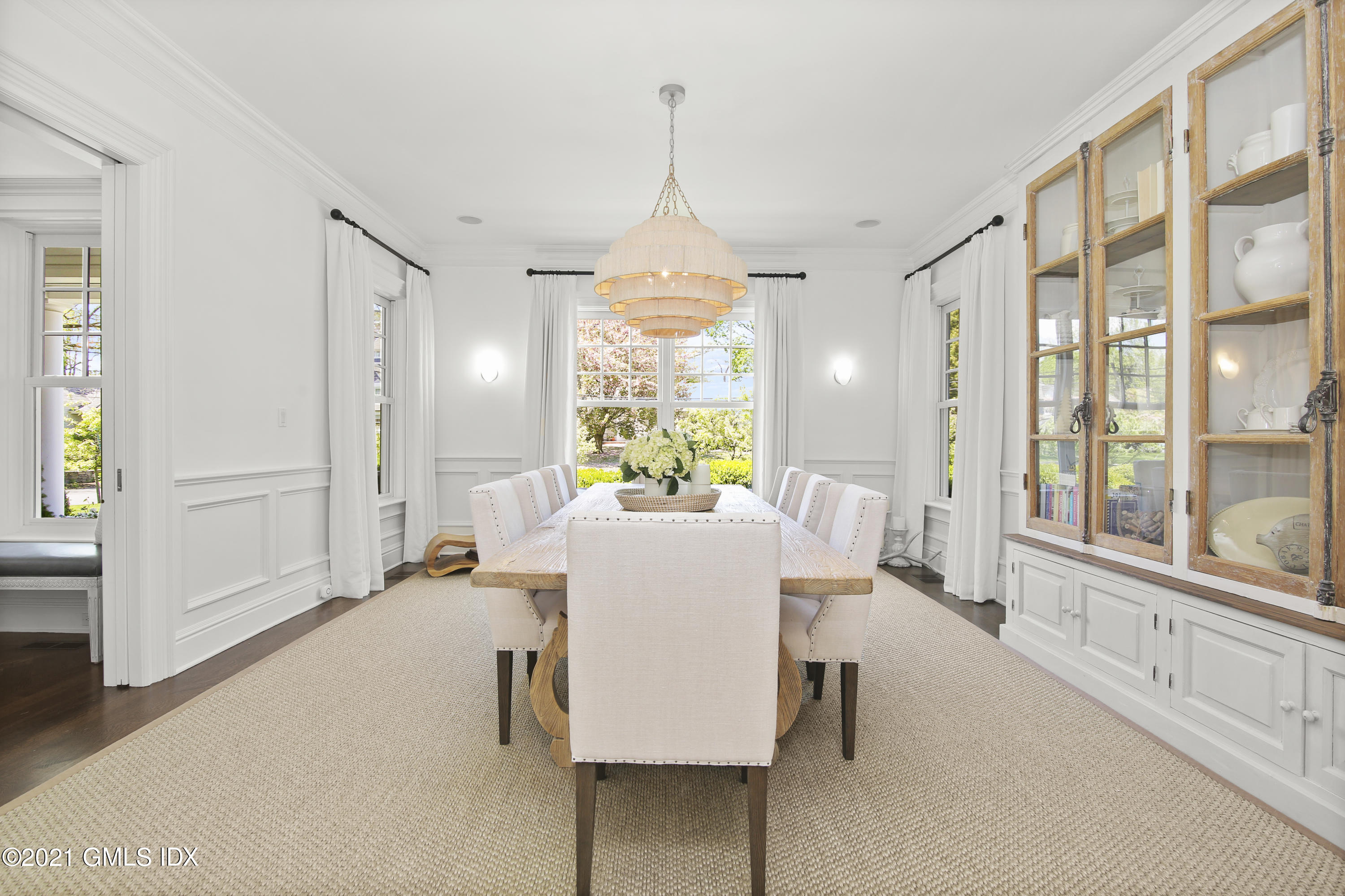 16 Benjamin Street Old Greenwich, CT 06870 - Photo 7 of 32 a dining room with furniture a chandelier and wooden floor