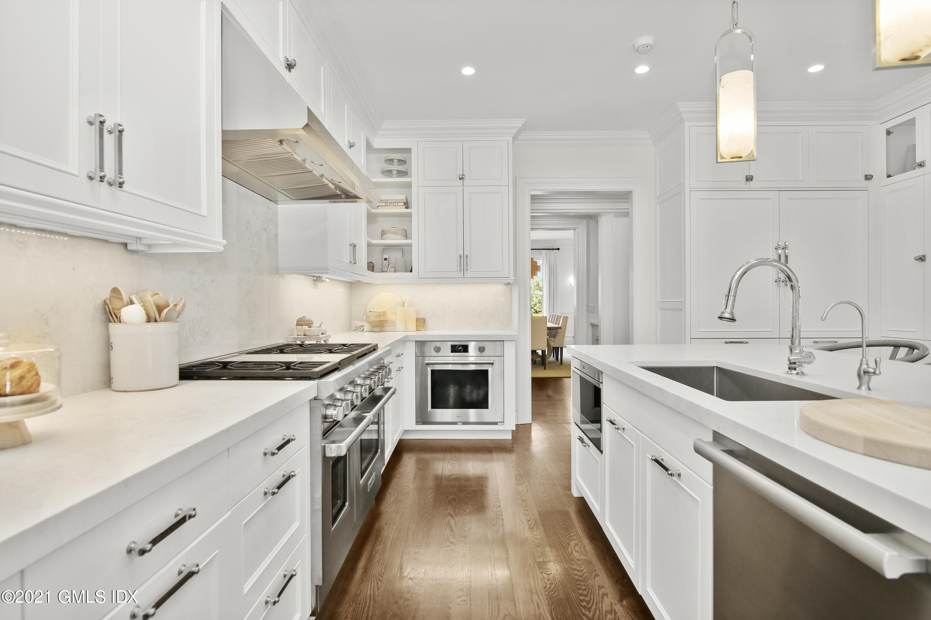 16 Benjamin Street Old Greenwich, CT 06870 - Photo 9 of 32 a kitchen with stainless steel appliances granite countertop a stove and a sink