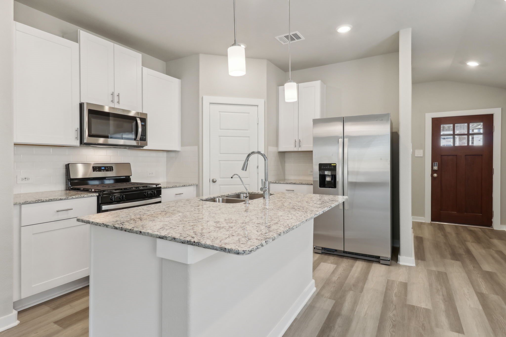 14301 Grey Pointe Court Conroe, TX 77302 - Photo 3 of 25 Photo is not of the actual home, but is an inspirational photo of builder’s model home and may depict options, furnishings, and/or decorator features that are not included