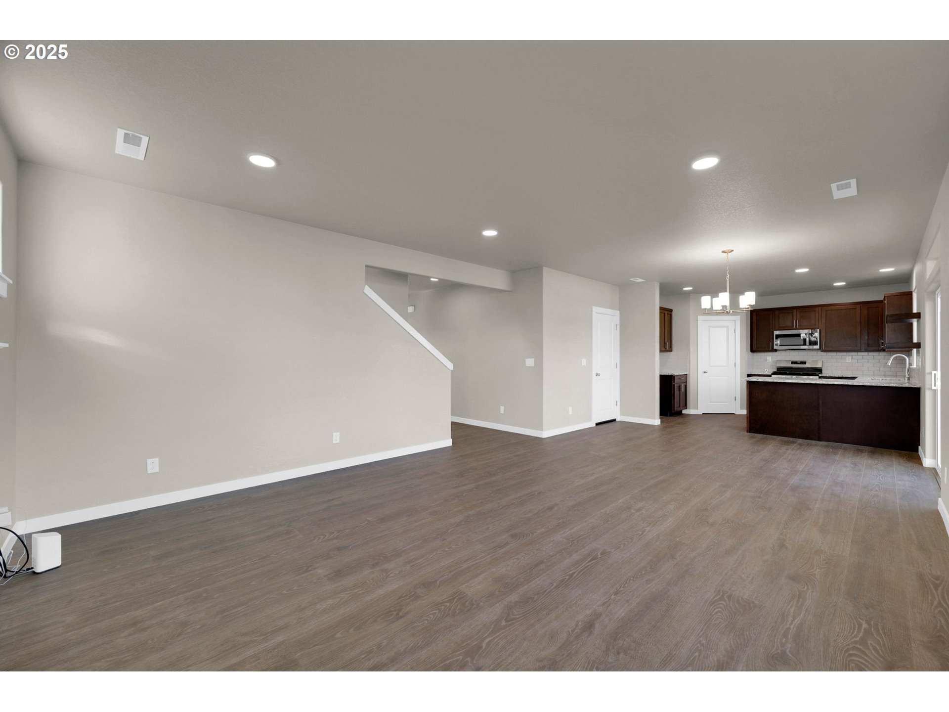 5679 Magnificence Way Eugene, OR 97402 - Photo 11 of 45 a view of a kitchen with a sink and a stove top oven