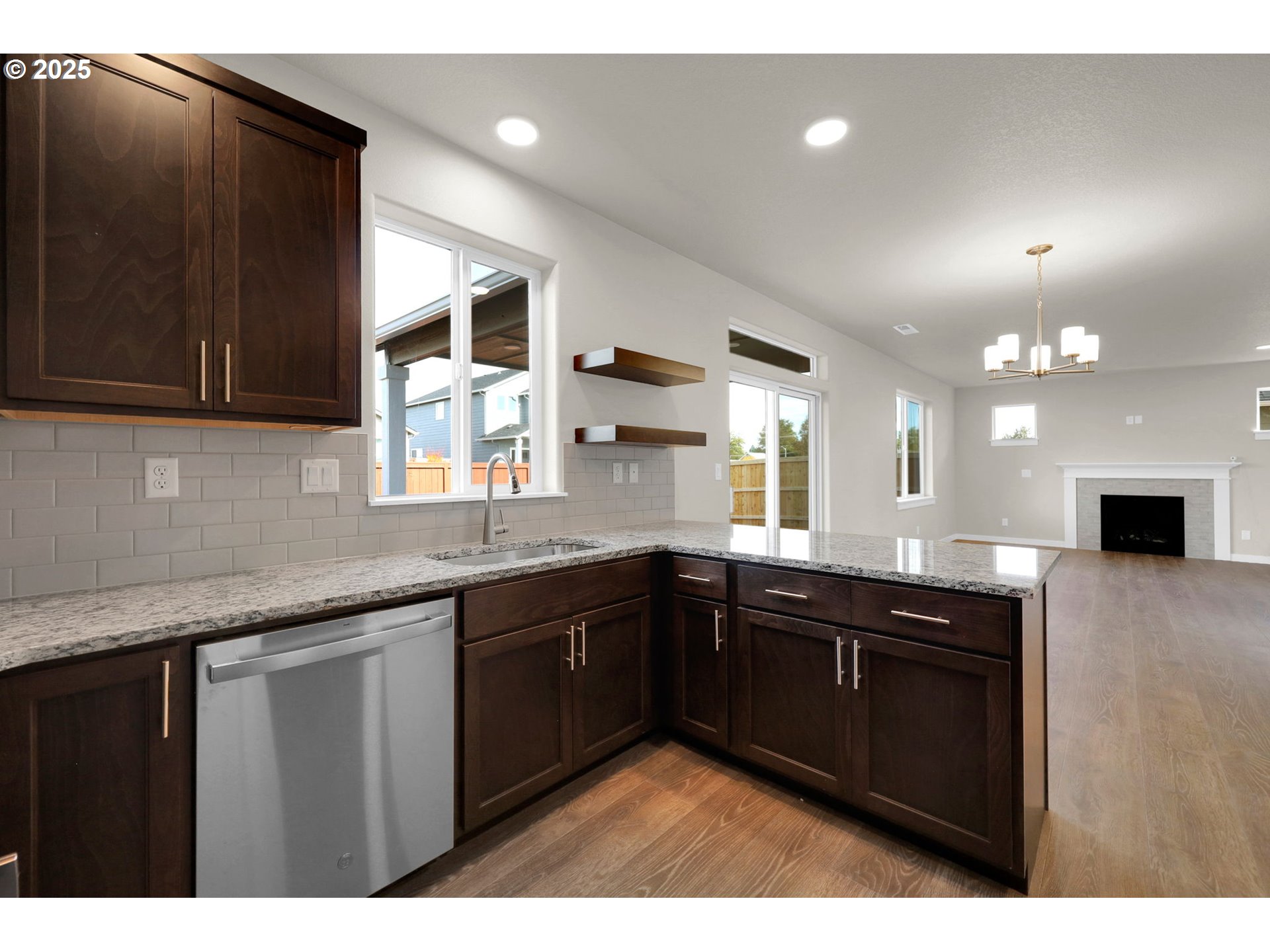 5679 Magnificence Way Eugene, OR 97402 - Photo 25 of 45 a kitchen with a sink and cabinets
